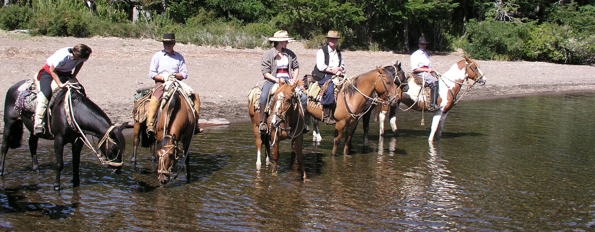 Riding on the Argentine/Chile border. Watering the horses
